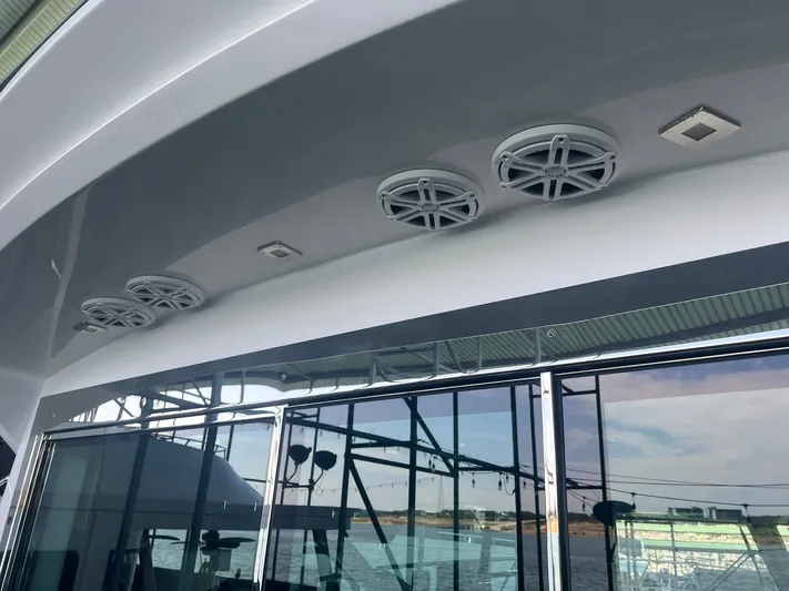 Mon Cheri Yacht Photos Pics 2018 Cruisers Yachts 54 Cantius with sleek exterior speakers and reflective glass windows.