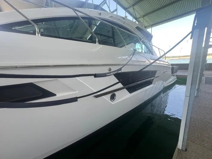 Mon Cheri Yacht Photos Pics 2018 Cruisers Yachts 54 Cantius docked in a covered marina.