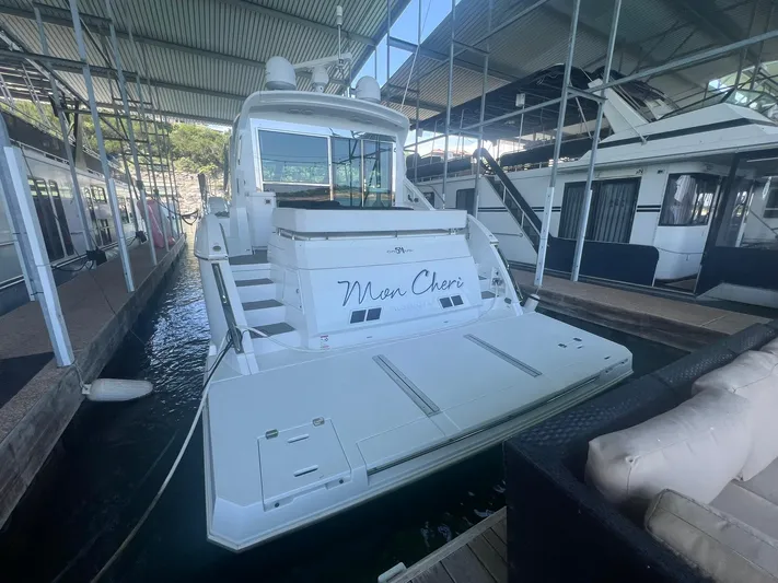 Mon Cheri Yacht Photos Pics 2018 Cruisers Yachts 54 Cantius docked in a marina.