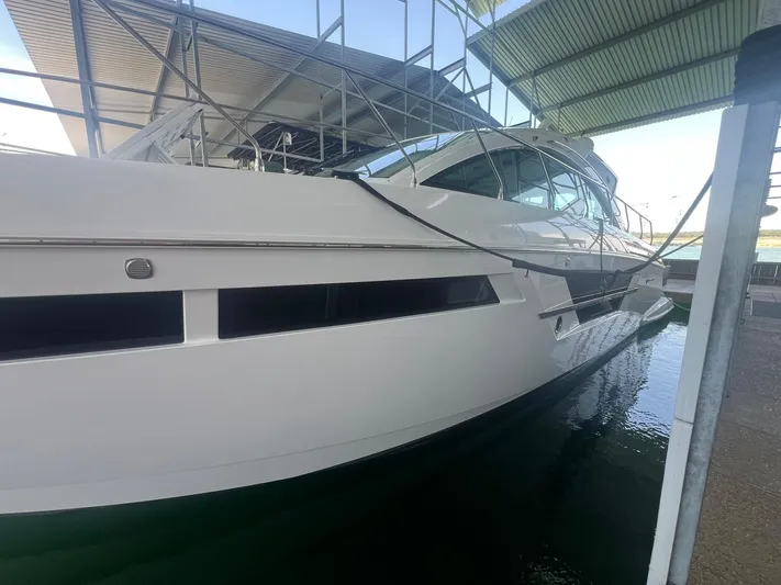 Mon Cheri Yacht Photos Pics 2018 Cruisers Yachts 54 Cantius docked under a covered marina.
