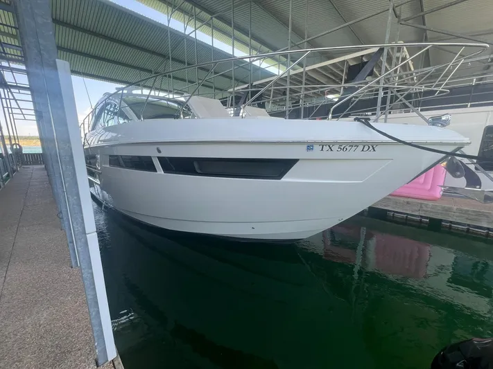 Mon Cheri Yacht Photos Pics 2018 Cruisers Yachts 54 Cantius docked in a covered marina.