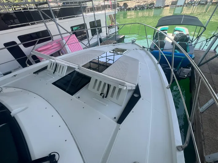 Mon Cheri Yacht Photos Pics 2018 Cruisers Yachts 54 Cantius docked, showcasing sleek deck design and modern features.