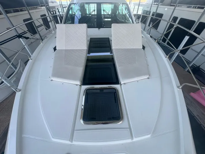 Mon Cheri Yacht Photos Pics 2018 Cruisers Yachts 54 Cantius deck with sun loungers and sleek design.