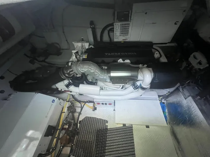 Mon Cheri Yacht Photos Pics Engine room of 2018 Cruisers Yachts 54 Cantius with visible machinery and components.