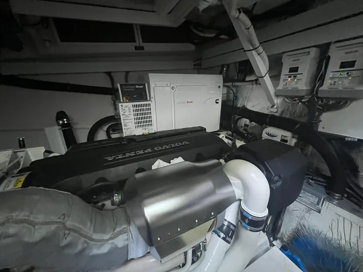 Mon Cheri Yacht Photos Pics Engine room of 2018 Cruisers Yachts 54 Cantius with Volvo Penta engine and Onan generator.