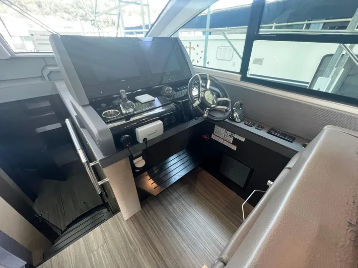 Mon Cheri Yacht Photos Pics 2018 Cruisers Yachts 54 Cantius helm with modern controls and steering wheel.