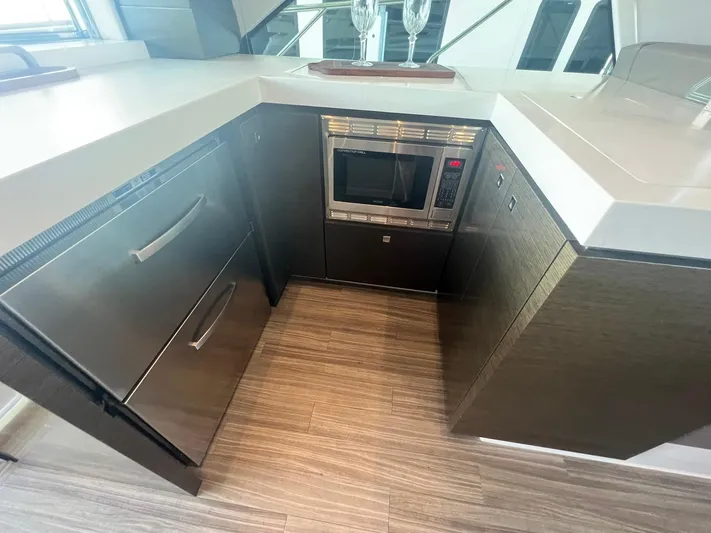 Mon Cheri Yacht Photos Pics Modern kitchen area in 2018 Cruisers Yachts 54 Cantius with microwave and drawers.