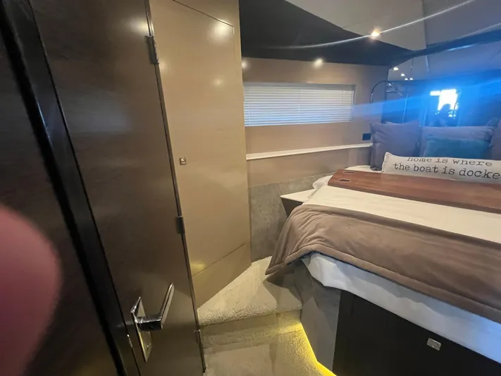 Mon Cheri Yacht Photos Pics Luxurious bedroom interior of 2018 Cruisers Yachts 54 Cantius with modern design and cozy bedding.