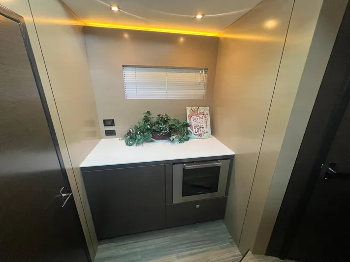 Mon Cheri Yacht Photos Pics Modern galley kitchen in 2018 Cruisers Yachts 54 Cantius with sleek cabinetry and decor.