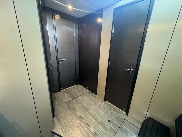 Mon Cheri Yacht Photos Pics Interior hallway of 2018 Cruisers Yachts 54 Cantius with modern wood doors.