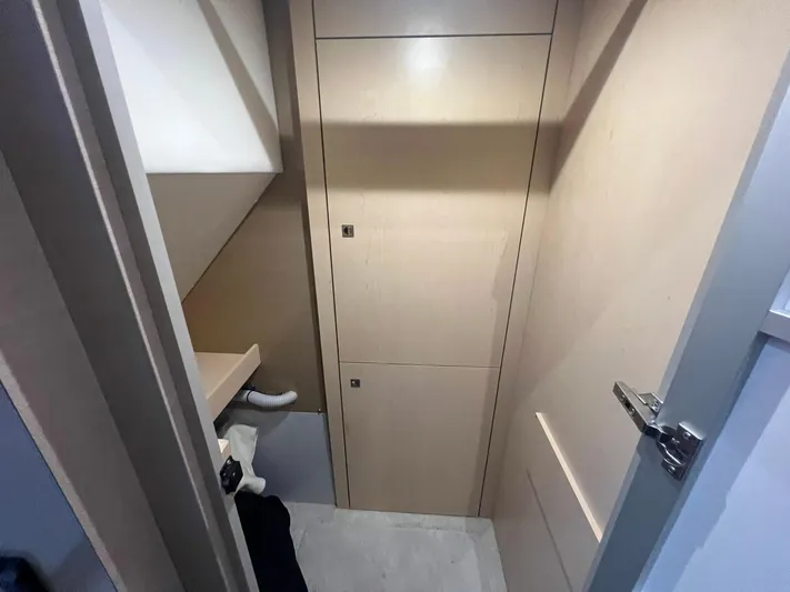 Mon Cheri Yacht Photos Pics 2018 Cruisers Yachts 54 Cantius interior storage space with light wood cabinetry.