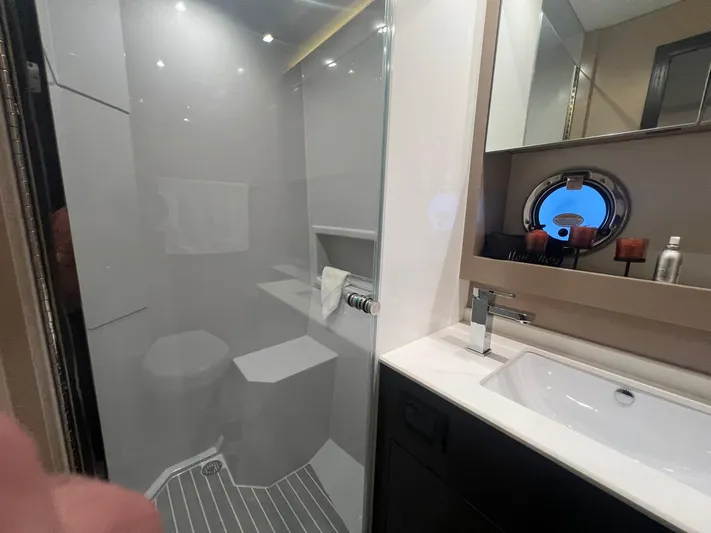 Mon Cheri Yacht Photos Pics Luxurious bathroom in 2018 Cruisers Yachts 54 Cantius with modern fixtures and porthole window.