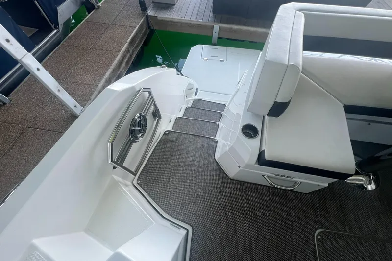 Mon Cheri Yacht Photos Pics 2018 Cruisers Yachts 54 Cantius boat interior with white seating and steps.