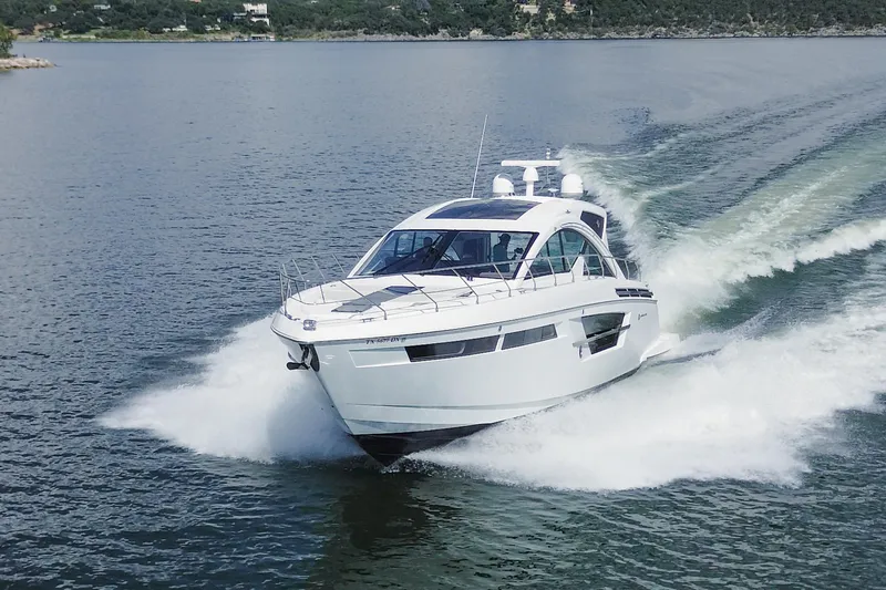 Mon Cheri Yacht Photos Pics 2018 Cruisers Yachts 54 Cantius speeding on a serene lake.