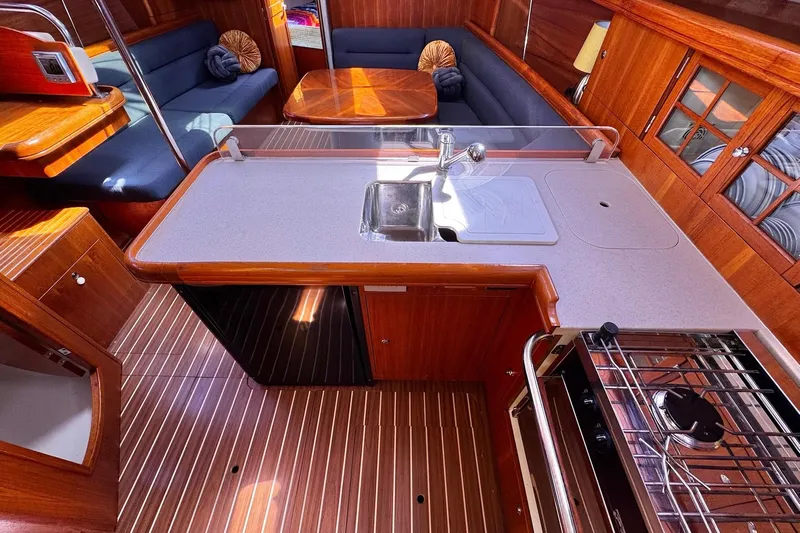  Yacht Photos Pics Luxurious 2006 Hunter 38 yacht interior with modern kitchen and cozy seating area.