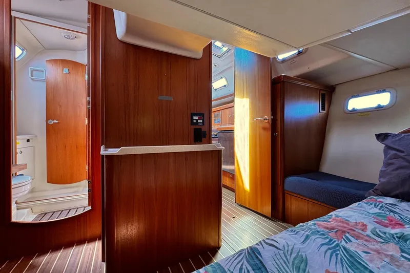  Yacht Photos Pics Interior of 2006 Hunter 38 sailboat with wood finish and cozy cabin layout.