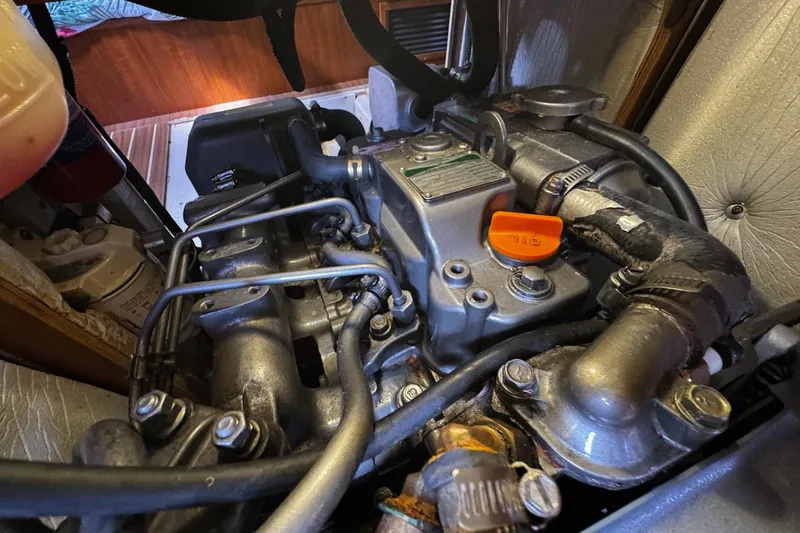  Yacht Photos Pics Engine compartment of a 2006 Hunter 38 sailboat, showcasing mechanical components.