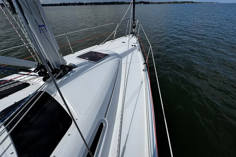  Yacht Photos Pics Sailboat deck view of 2006 Hunter 38 on calm waters.