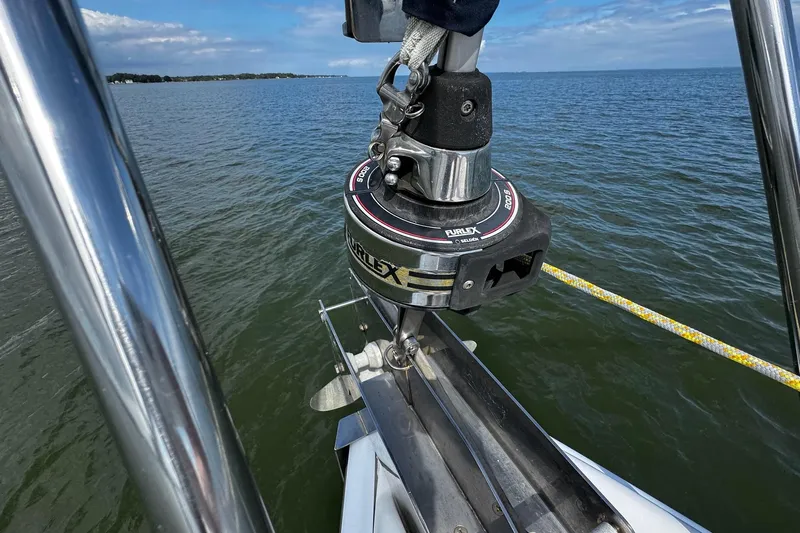  Yacht Photos Pics Close-up of a 2006 Hunter 38 sailboat's furling system on calm waters.