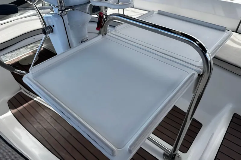  Yacht Photos Pics Cockpit table on a 2006 Hunter 38 sailboat with stainless steel frame.