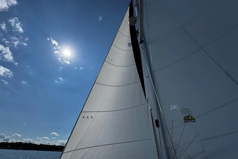  Yacht Photos Pics Sailing on a 2006 Hunter 38 yacht under clear blue skies.