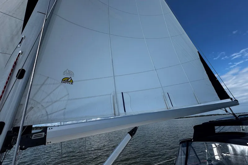  Yacht Photos Pics Sailing on a 2006 Hunter 38 yacht with Doyle sails against a clear blue sky.