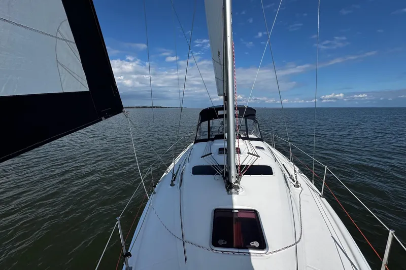  Yacht Photos Pics Sailing on a 2006 Hunter 38 yacht under clear blue skies.