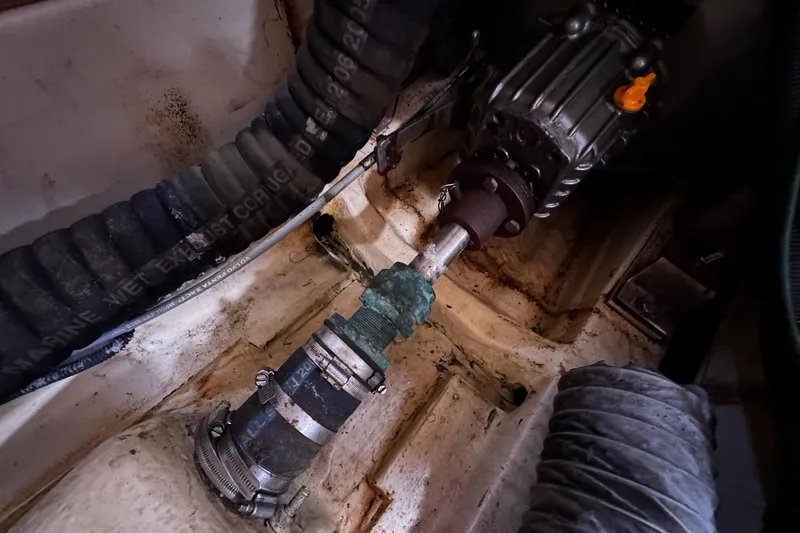  Yacht Photos Pics Engine compartment of a 2006 Hunter 38 sailboat, showing mechanical components and hoses.