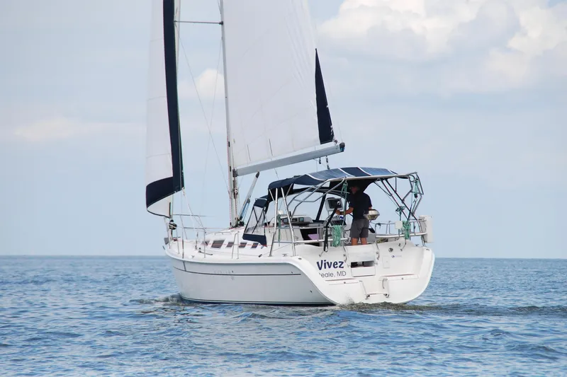  Yacht Photos Pics Sailing yacht "Vivez," a 2006 Hunter 38, cruising on open water under clear skies.