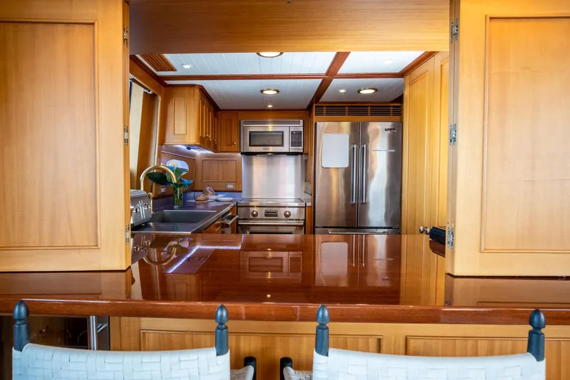 Fortuna Yacht Photos Pics Luxurious kitchen interior of a 1999 Palmer Johnson Motor Yacht with modern appliances.