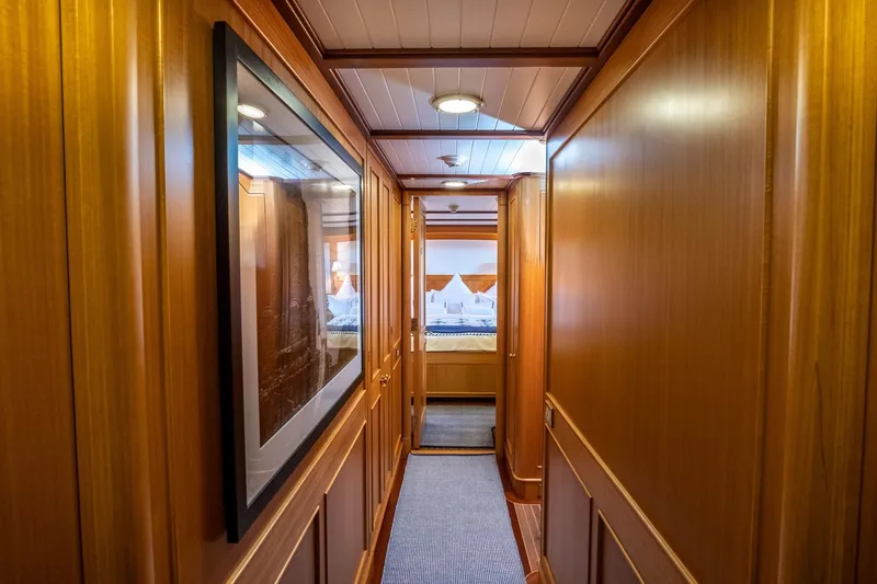 Fortuna Yacht Photos Pics Luxurious wooden hallway inside a 1999 Palmer Johnson motor yacht.