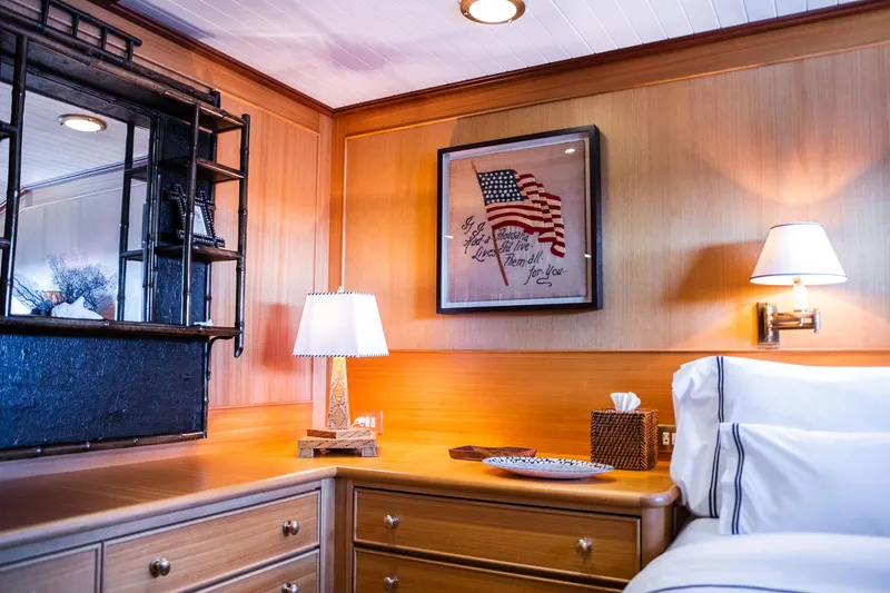 Fortuna Yacht Photos Pics Luxurious cabin interior of 1999 Palmer Johnson Motor Yacht with elegant decor and American flag artwork.