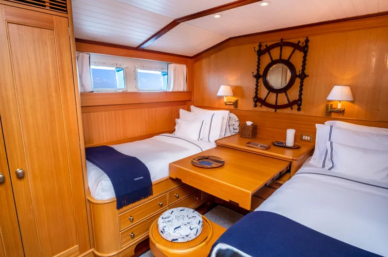 Fortuna Yacht Photos Pics Luxurious 1999 Palmer Johnson motor yacht cabin with twin beds and nautical decor.
