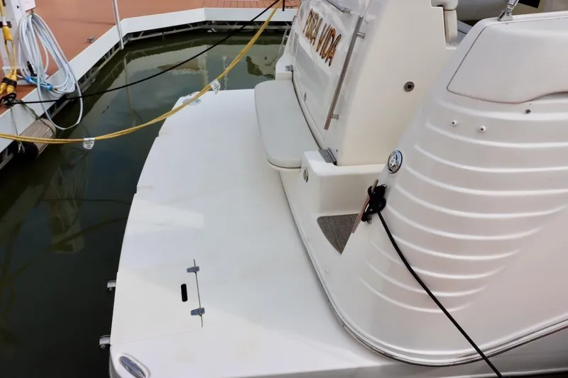 Pura Vida Yacht Photos Pics 2006 Rinker 360 Express Cruiser docked, showing rear deck and mooring lines.