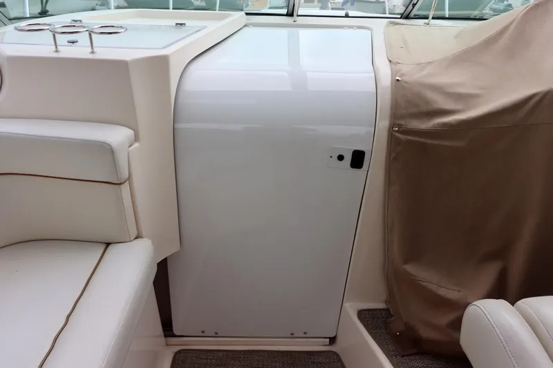 Pura Vida Yacht Photos Pics 2006 Rinker 360 Express Cruiser interior with white seating and covered console.