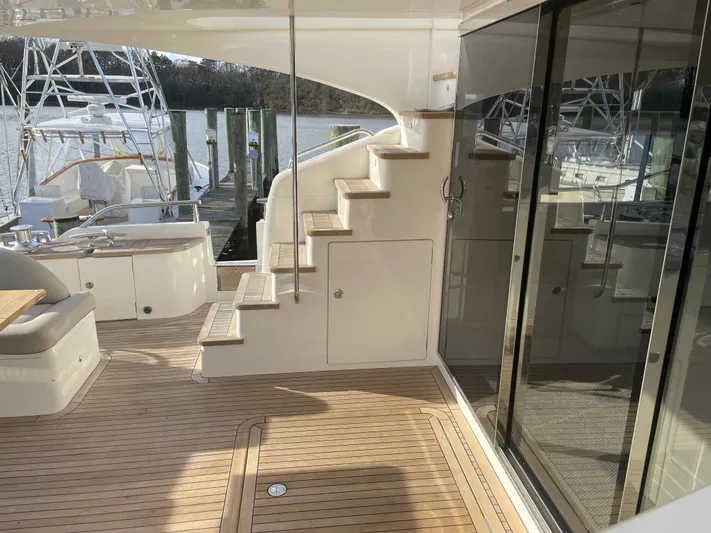 Yacht Photos Pics Luxurious 2012 Princess 72 Motor Yacht deck with elegant wooden flooring and sleek design.