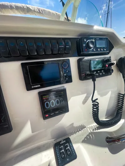  Yacht Photos Pics Control panel of a 2016 Sailfish 320CC boat with navigation and communication equipment.