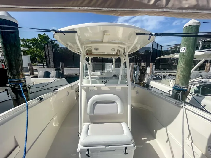  Yacht Photos Pics 2016 Sailfish 320CC boat docked, featuring a spacious deck and seating area.