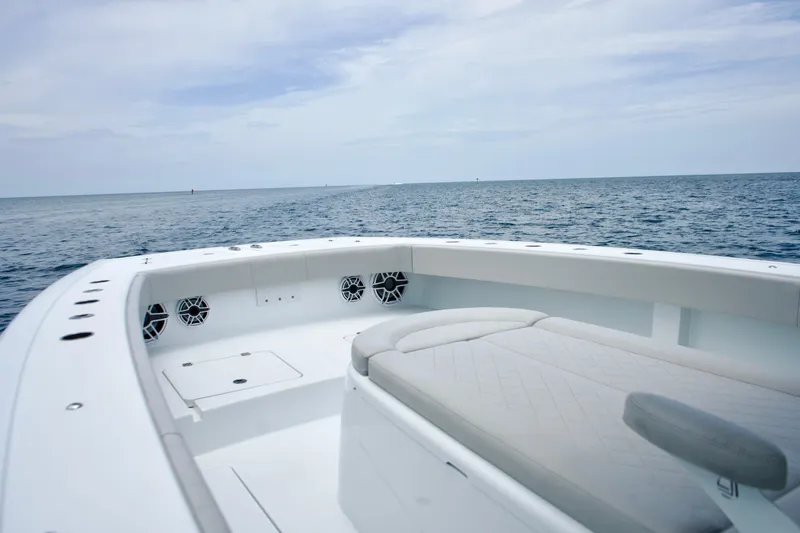  Yacht Photos Pics Freeman 42 LR 2022 boat interior with ocean view, featuring cushioned seating and speakers.