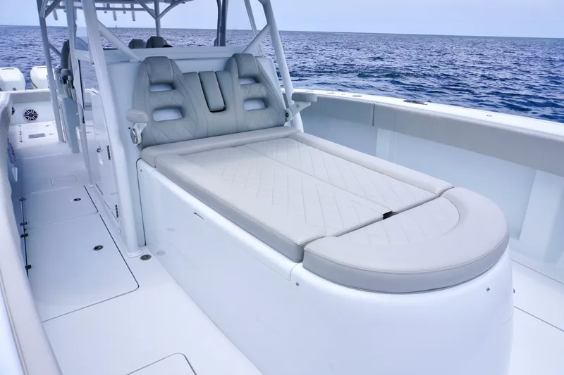  Yacht Photos Pics Luxurious seating on a 2022 Freeman 42 LR boat, with ocean backdrop.