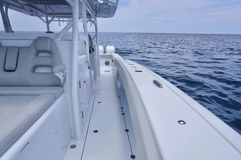  Yacht Photos Pics 2022 Freeman 42 LR boat on open water, showcasing sleek design and comfortable seating.