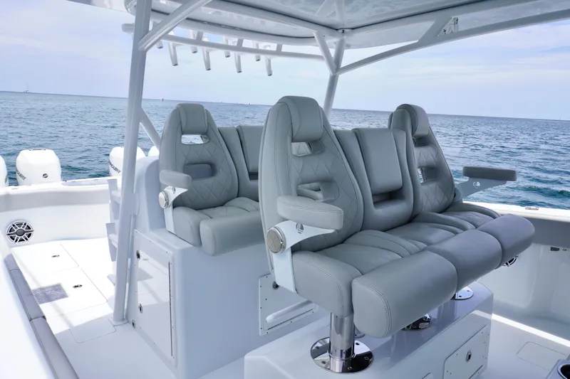  Yacht Photos Pics Luxury seating on a 2022 Freeman 42 LR boat with ocean backdrop.
