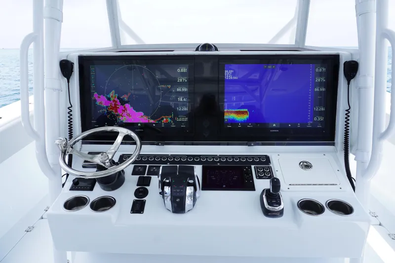  Yacht Photos Pics Control panel of a 2022 Freeman 42 LR boat with advanced navigation screens.