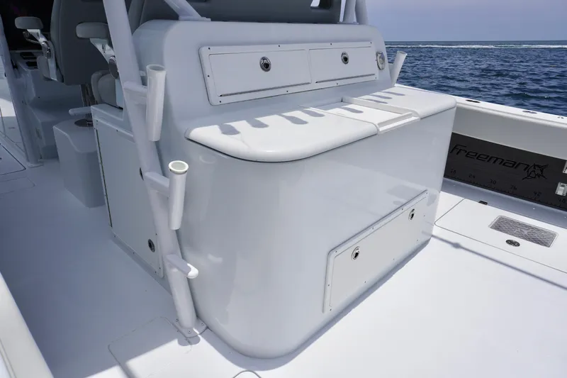  Yacht Photos Pics Freeman 42 LR boat interior, 2022 model, featuring sleek white seating and storage compartments.