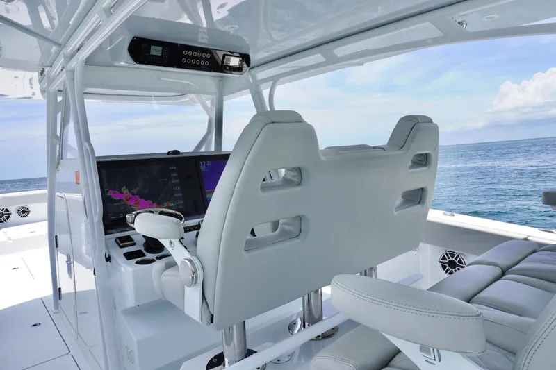  Yacht Photos Pics 2022 Freeman 42 LR boat cockpit with modern navigation system and ocean view.