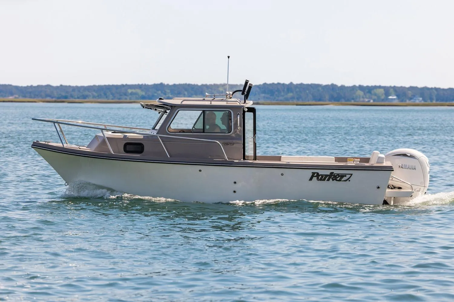 Manufacturer Provided Image: 2026 Parker 217 Explorer boat cruising on calm water.