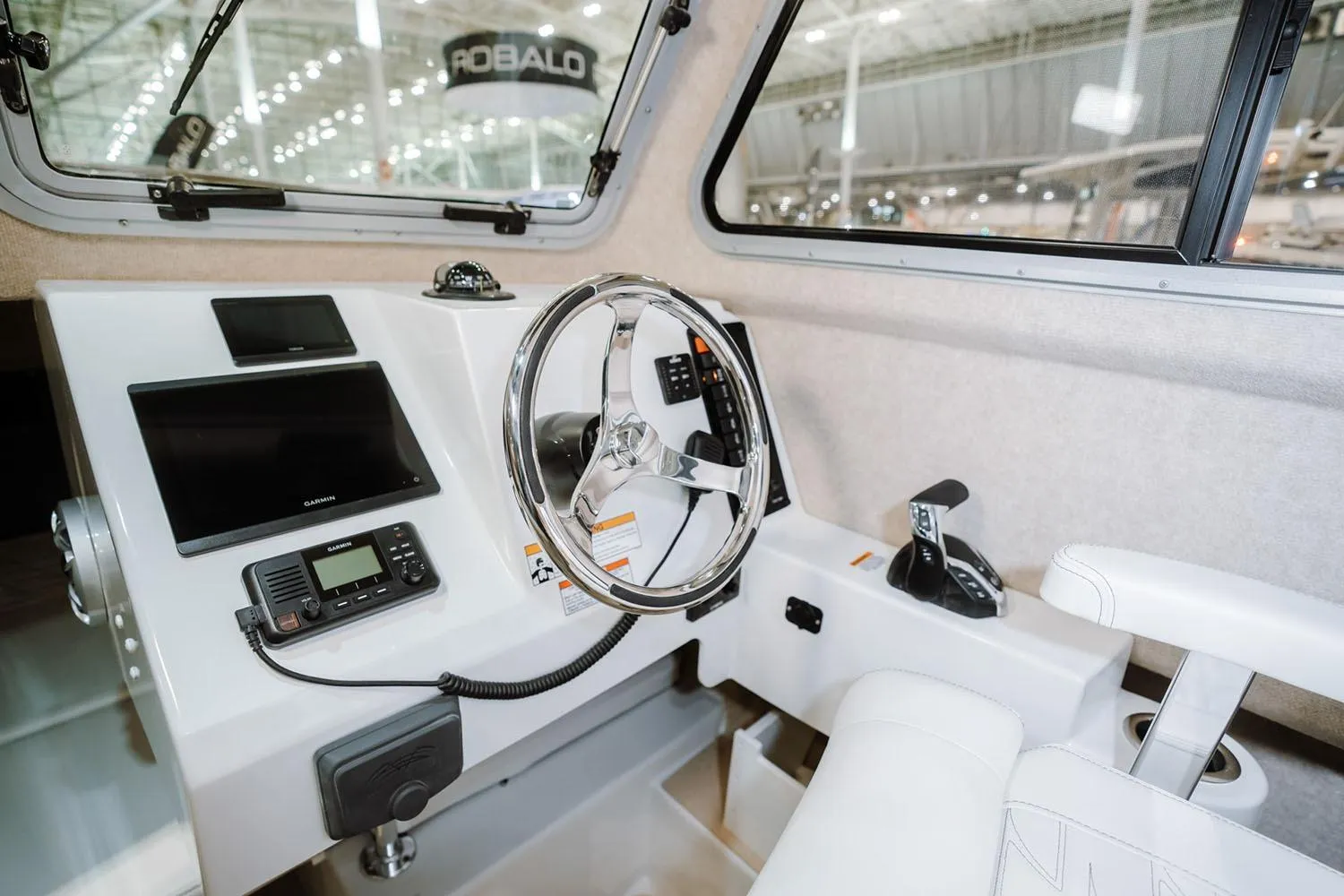 Manufacturer Provided Image: Interior of 2026 Parker 217 Explorer boat with modern steering and navigation controls.