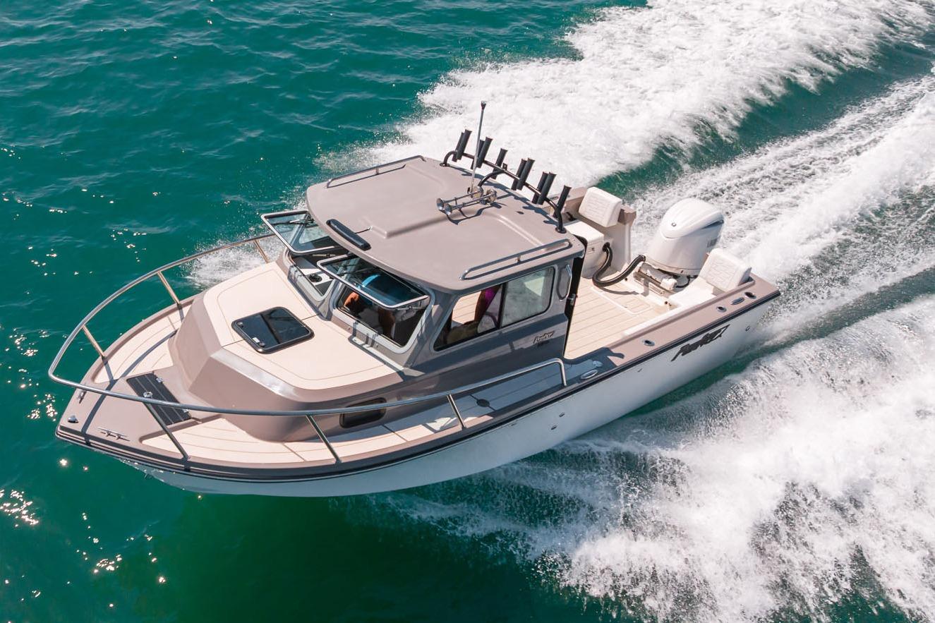 Manufacturer Provided Image: 2026 Parker 217 Explorer boat cruising on clear blue water.