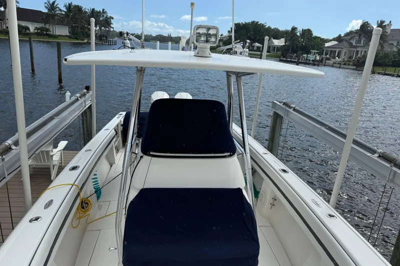  Yacht Photos Pics 2009 Intrepid 323 boat docked by waterfront, featuring sleek design and spacious deck.