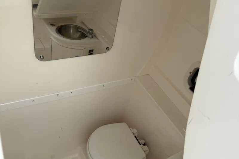  Yacht Photos Pics Compact bathroom in 2009 Intrepid 323 boat with sink and toilet.